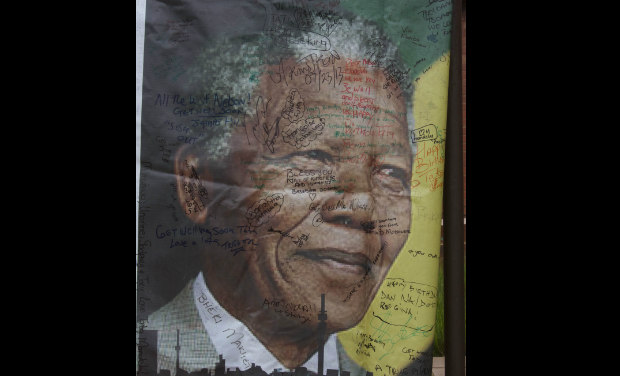 A giant signed poster with messages of support is attached to the former Soweto home, turned museum, of former South African president Nelson Mandela, Soweto, South Africa. -AP A giant signed poster with messages of support is attached to the former Soweto home, turned museum, of former South African president Nelson Mandela, Soweto, South Africa. -AP